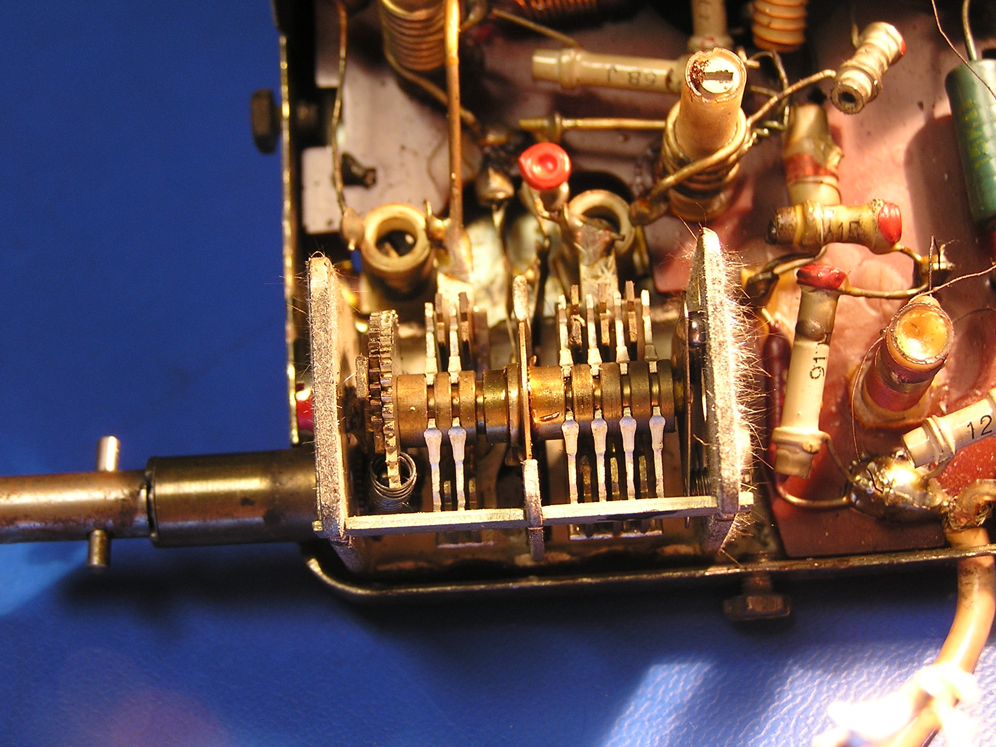 A 1960s variable air-spaced capacitor with tin whiskers over 8mm long growing from its tin-plated frame