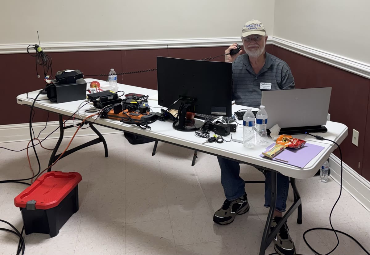 Chuck (WA4USA) at the radio desk, Baldwin County Coliseum shelter in Robertsdale